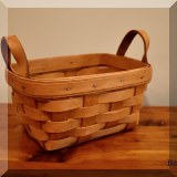 D75. Longaberger small basket with leather handles. - $12 